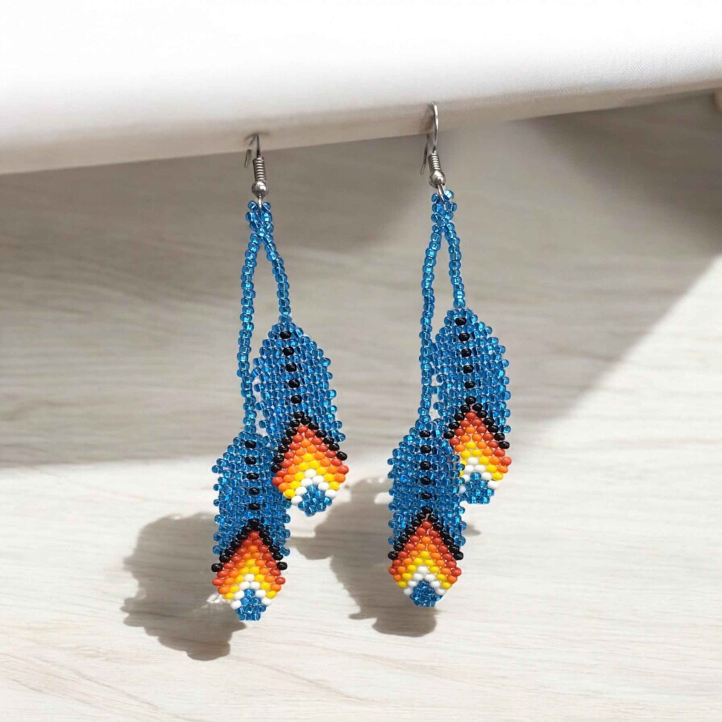 OldTribes™ light blue feather earrings