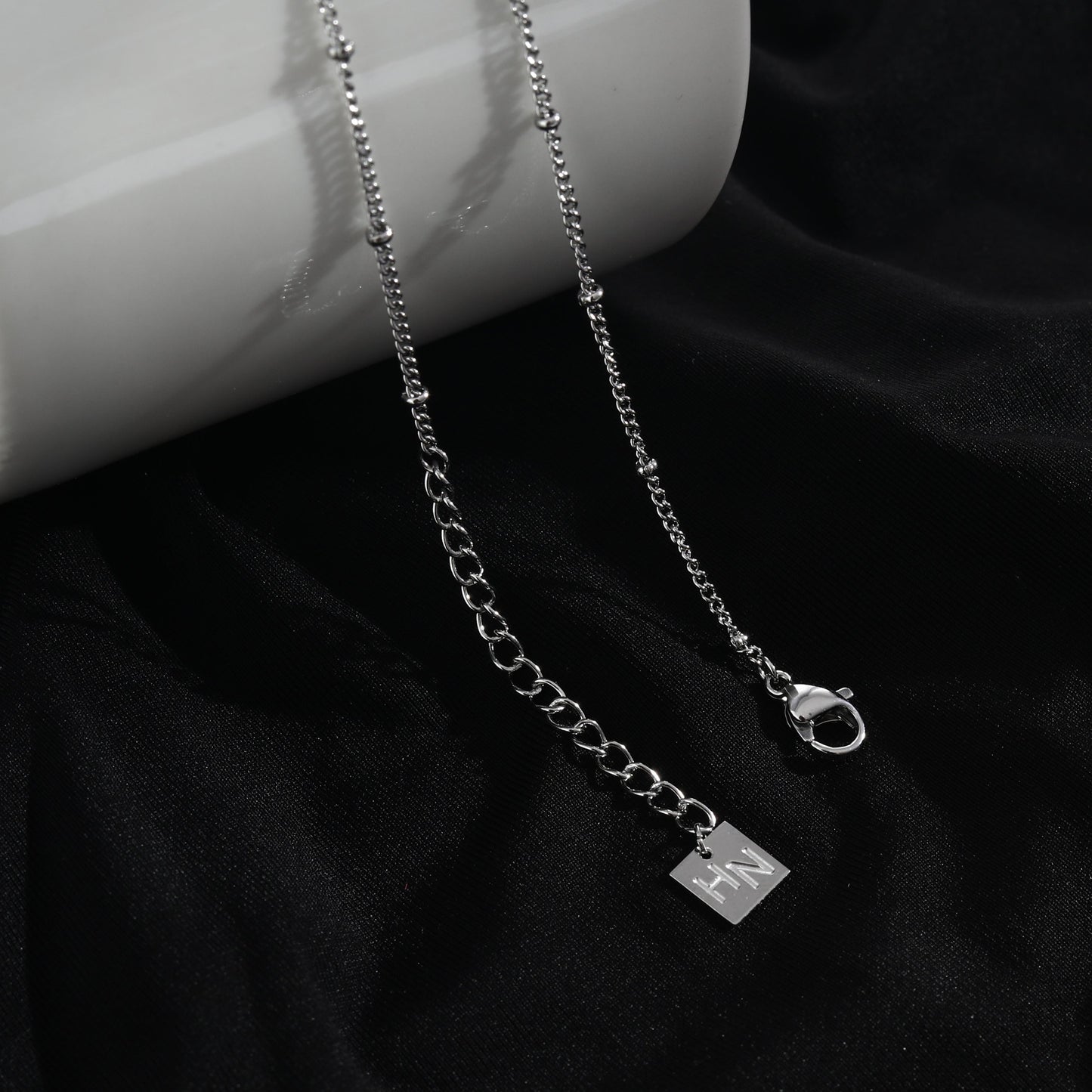 LERATI Beaded Chain with an Encased Fresh Water Pearl Pendant in Silver
