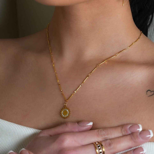 NOMIA Gold: Radiant Sunburst Pendant Zirconia Chain Necklace