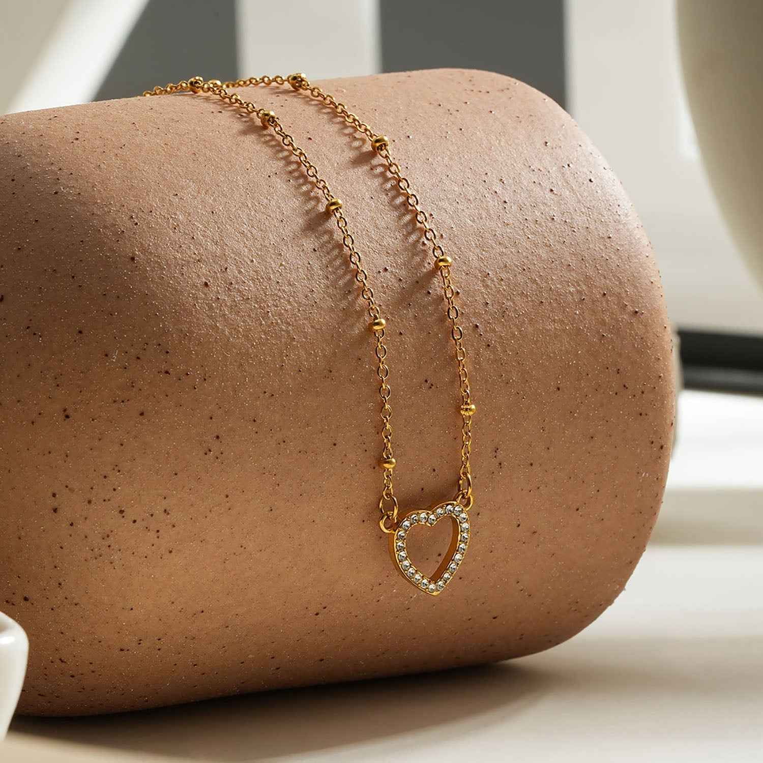 Style CHERISH Gold: Beaded Chain Anchoring an Elegant Pavé Heart Charm Pendant