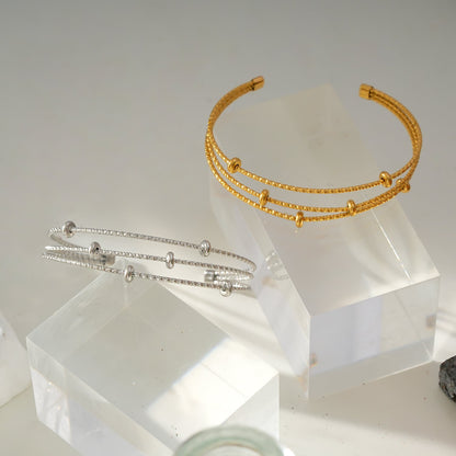 Style FARZIKA Gold: Triple Stacked Textured Beaded Bracelet